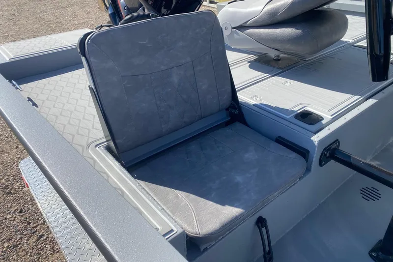 Slide: The Image of 2026 G3 Bay 19 GX boat seat with gray upholstery and diamond-patterned flooring. - 17