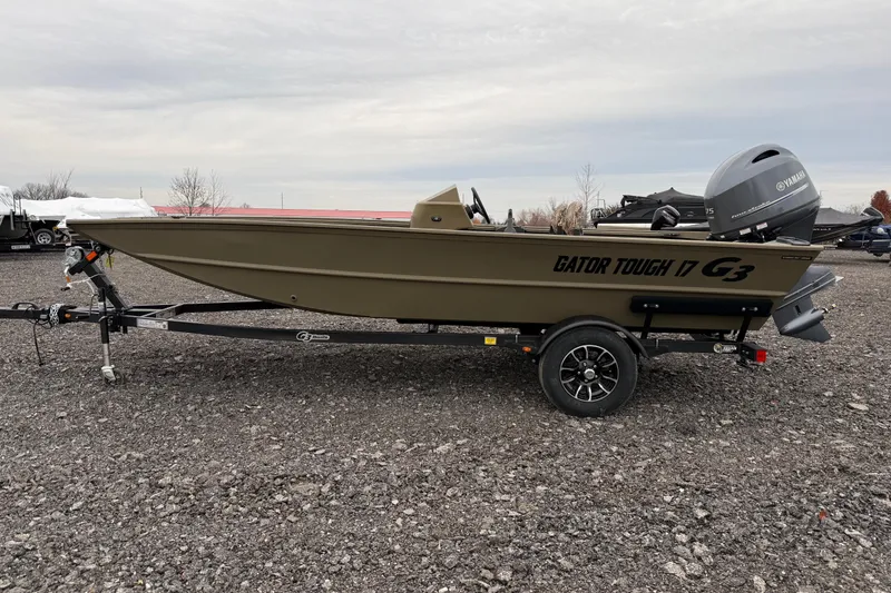 The Image of 2026 G3 Gator Tough 17 SC boat on trailer, side view, outdoors. - 1