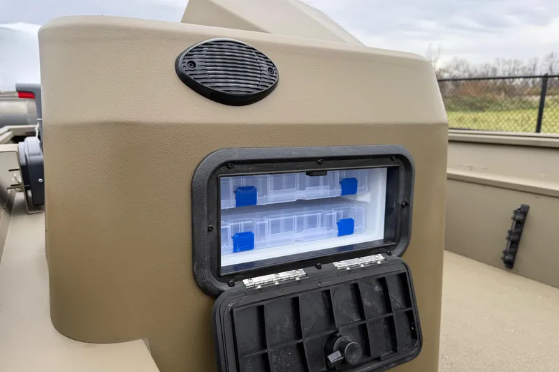 Slide: The Image of 2026 G3 Gator Tough 17 SC boat storage compartment with tackle boxes and speaker. - 10