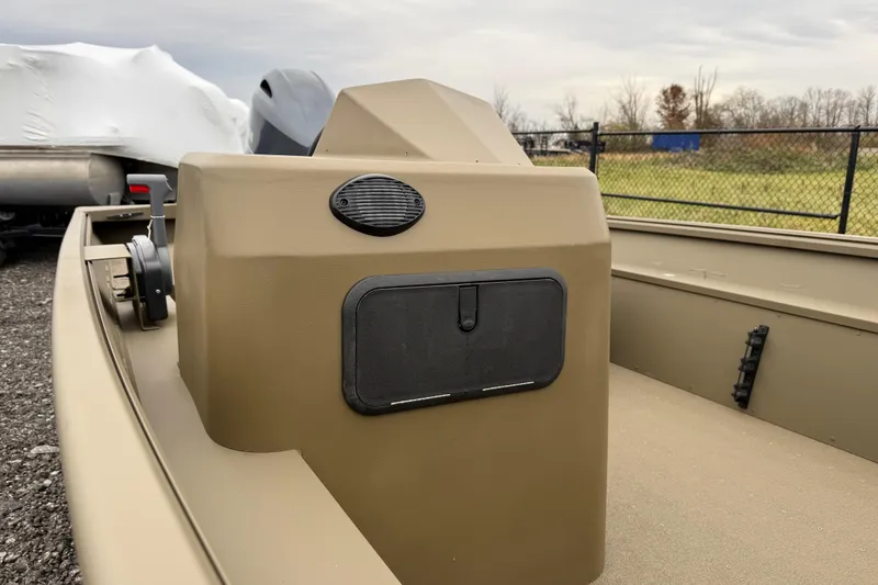 Slide: The Image of 2026 G3 Gator Tough 17 SC boat console, beige color, outdoor setting. - 12