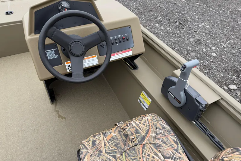 Slide: The Image of 2026 G3 Gator Tough 17 SC boat interior with steering wheel and control panel. - 16