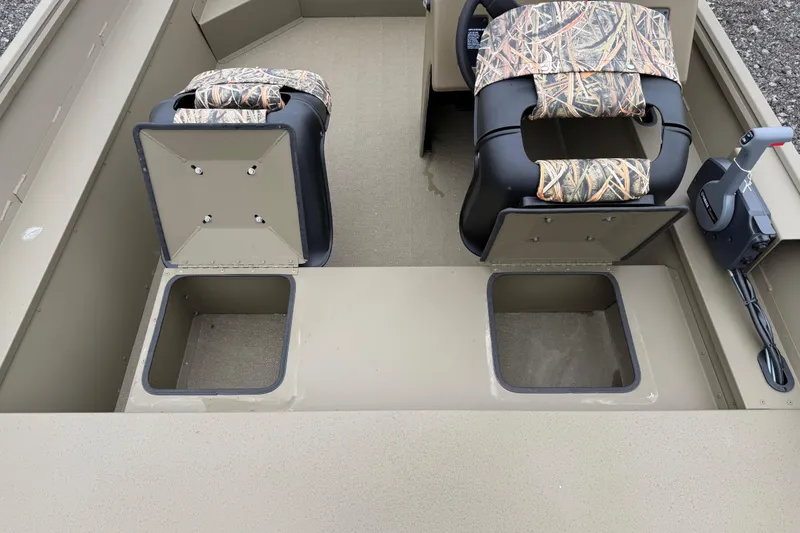 Slide: The Image of 2026 G3 Gator Tough 17 SC boat interior with camo seats and storage compartments. - 17
