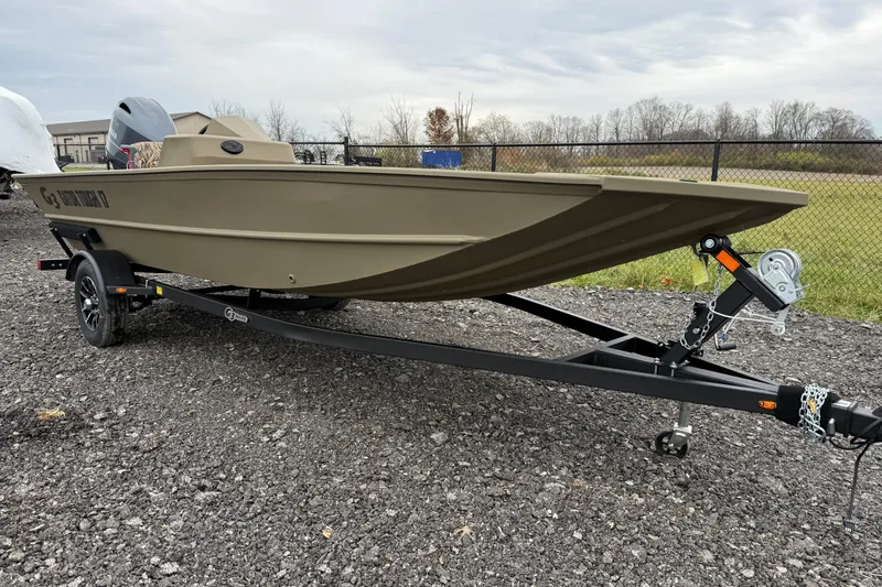 Slide: The Image of 2026 G3 Gator Tough 17 SC boat on trailer, parked outdoors. - 3
