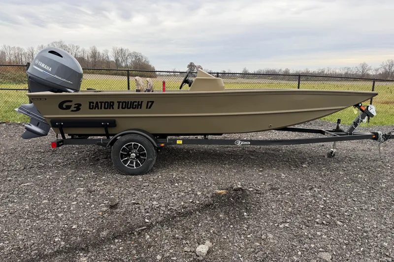Slide: The Image of 2026 G3 Gator Tough 17 SC boat on trailer with Yamaha outboard motor. - 4