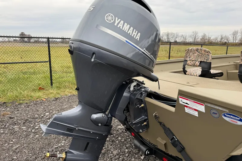 Slide: The Image of 2026 G3 Gator Tough 17 SC boat with Yamaha outboard motor, parked outdoors. - 6
