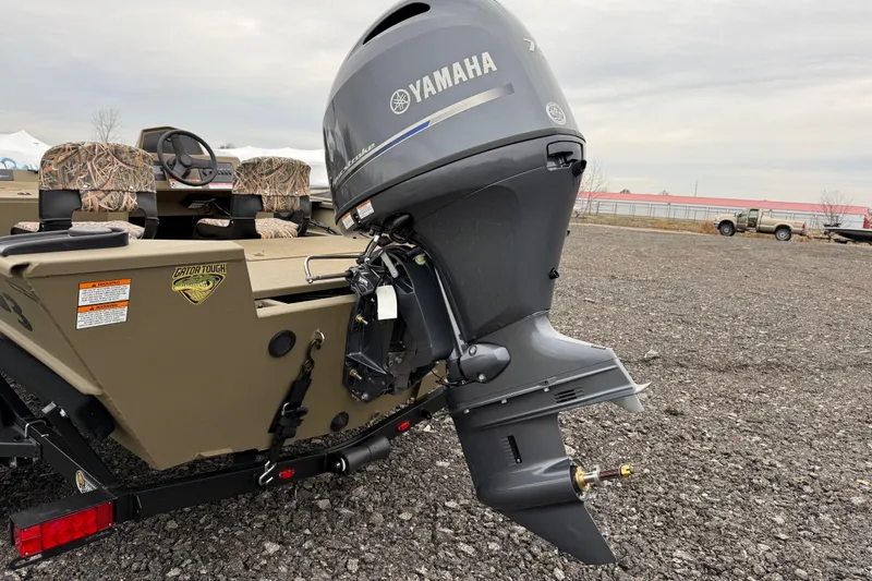 Slide: The Image of 2026 G3 Gator Tough 17 SC boat with Yamaha outboard motor on gravel lot. - 7