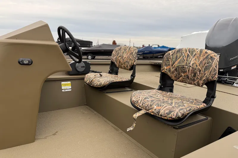 Slide: The Image of 2026 G3 Gator Tough 17 SC boat with camo seats and steering console. - 9