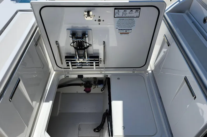 Slide: The Image of JL Audio speaker on 2026 Pursuit S 328 Sport boat interior. - 12