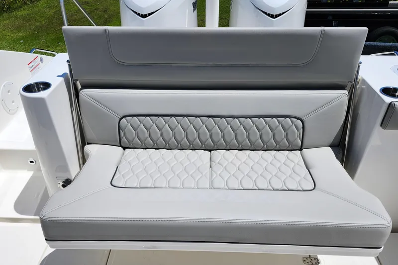 Slide: The Image of 2026 Pursuit S 328 Sport boat deck with storage compartment and cup holders. - 17