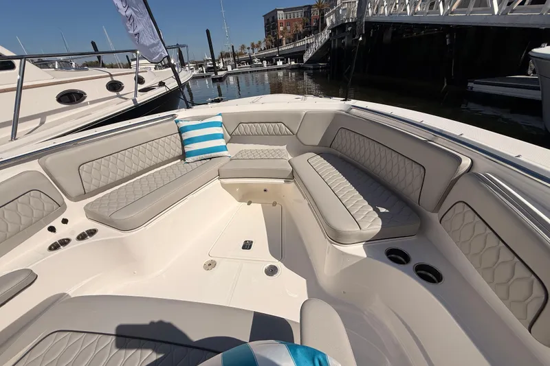 Slide: The Image of Luxurious seating area on 2026 Pursuit S 328 Sport boat, docked at marina. - 48