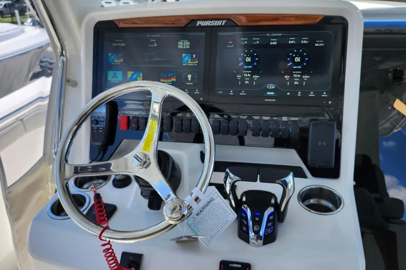 Slide: The Image of 2026 Pursuit S 328 Sport boat with sleek design and spacious seating. - 5