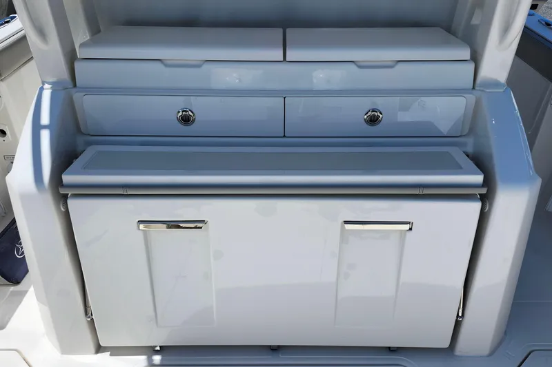 Slide: The Image of 2026 Pursuit S 328 Sport boat dashboard with steering wheel and digital display. - 7