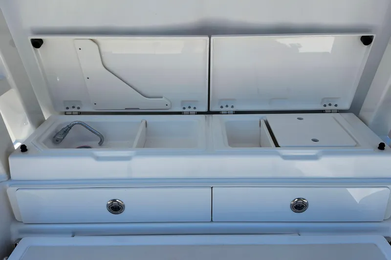 Slide: The Image of 2026 Pursuit S 328 Sport boat helm with modern controls and navigation display. - 8