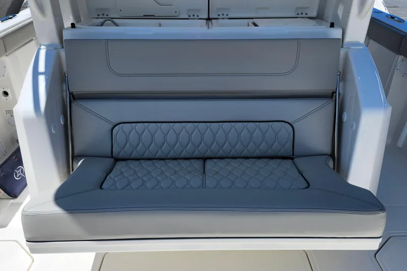 Slide: The Image of 2026 Pursuit S 328 Sport boat interior with sleek storage compartments and modern design. - 9