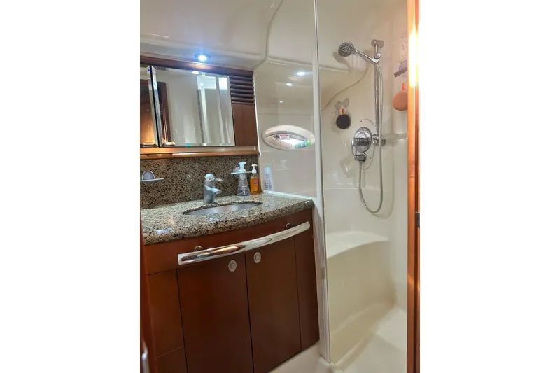 Slide: The Image of Luxurious bathroom in 2006 Sea Ray 52 Sundancer yacht with granite countertop and shower. - 10