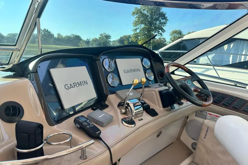 Slide: The Image of Helm of 2006 Sea Ray 52 Sundancer with Garmin navigation displays and controls. - 13