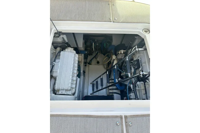 Slide: The Image of Engine compartment of 2006 Sea Ray 52 Sundancer yacht, showcasing mechanical components. - 15