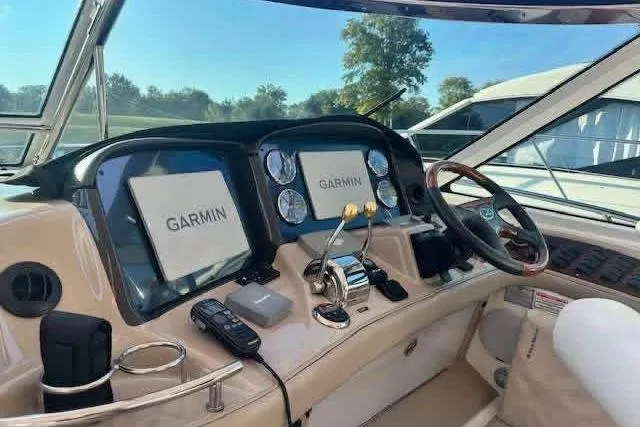 Slide: The Image of Interior of 2006 Sea Ray 52 Sundancer with beige sofa and cushions. - 4