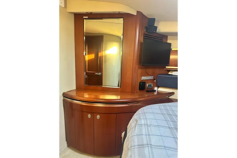 Slide: The Image of Interior of 2006 Sea Ray 52 Sundancer with wooden cabinetry and mirror. - 9