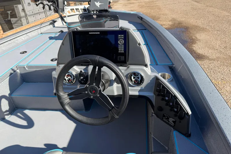 Slide: The Image of 2026 Xpress H17 boat dashboard with steering wheel and navigation display. - 7