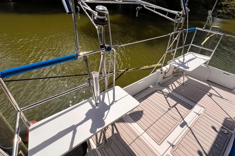 Slide: The Image of Deck view of 2002 Endeavour Trawlercat 36, featuring stainless steel railings and seating. - 15
