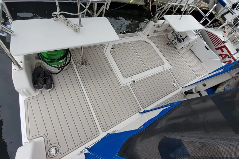 Slide: The Image of Deck of 2002 Endeavour Trawlercat 36 with non-slip flooring and storage compartments. - 18