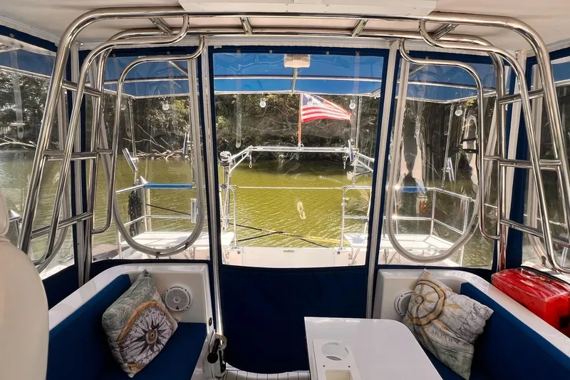 Slide: The Image of Interior view of 2002 Endeavour Trawlercat 36 with seating and American flag. - 19