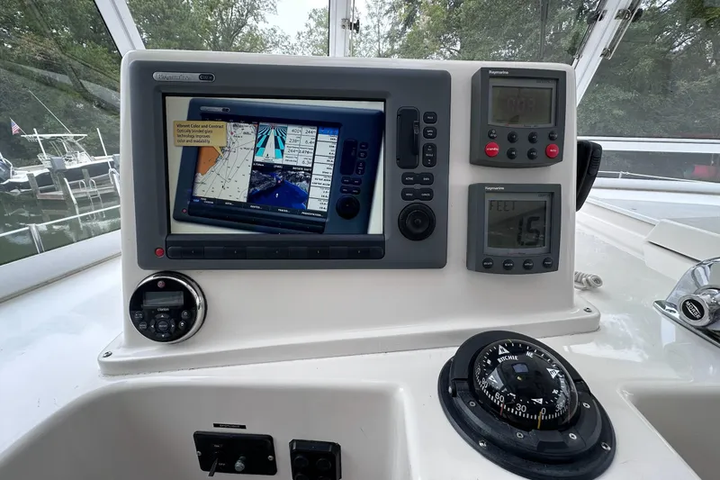 Slide: The Image of Control panel of a 2002 Endeavour Trawlercat 36 with navigation and monitoring systems. - 27