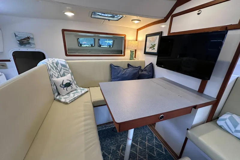 Slide: The Image of Interior of 2002 Endeavour Trawlercat 36 with cozy seating and modern decor. - 31