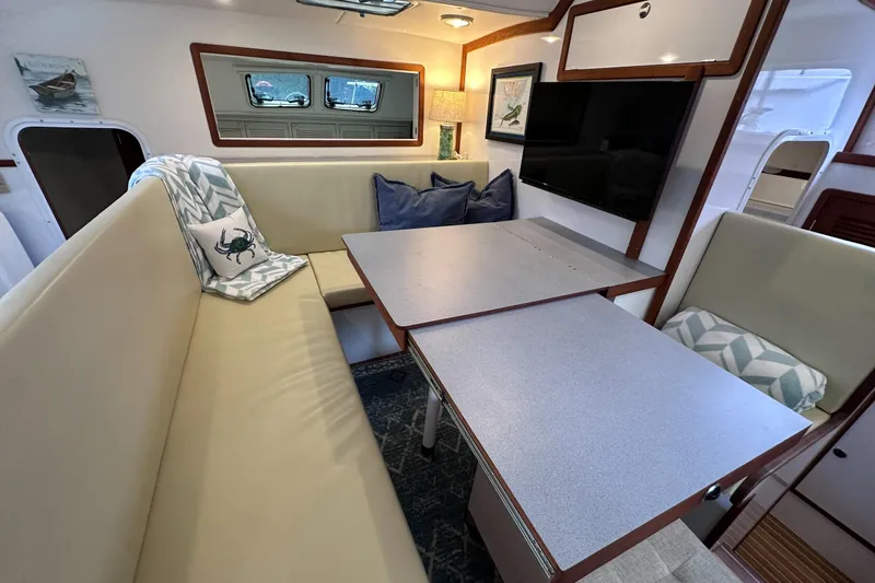 Slide: The Image of Interior of 2002 Endeavour Trawlercat 36 with cozy seating and dining area. - 32