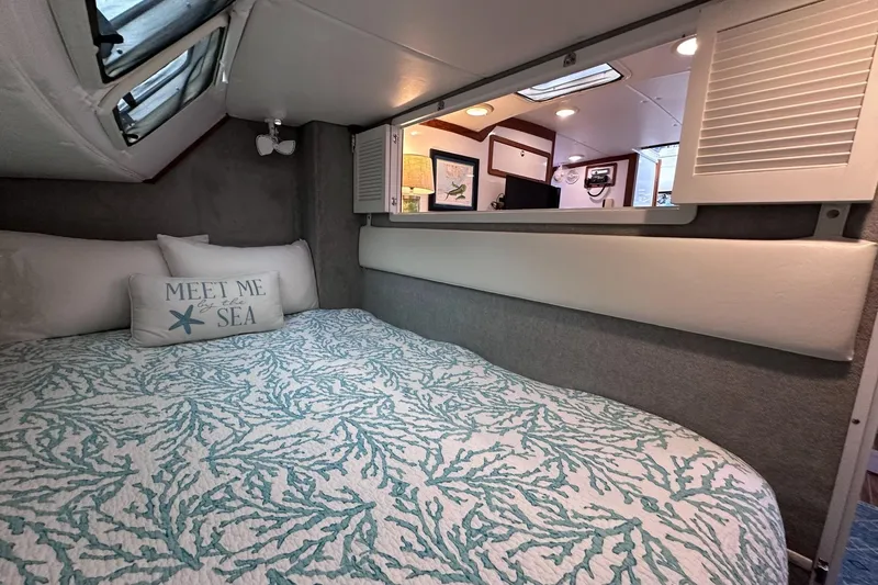 Slide: The Image of Cozy cabin interior of 2002 Endeavour Trawlercat 36 with nautical decor. - 37