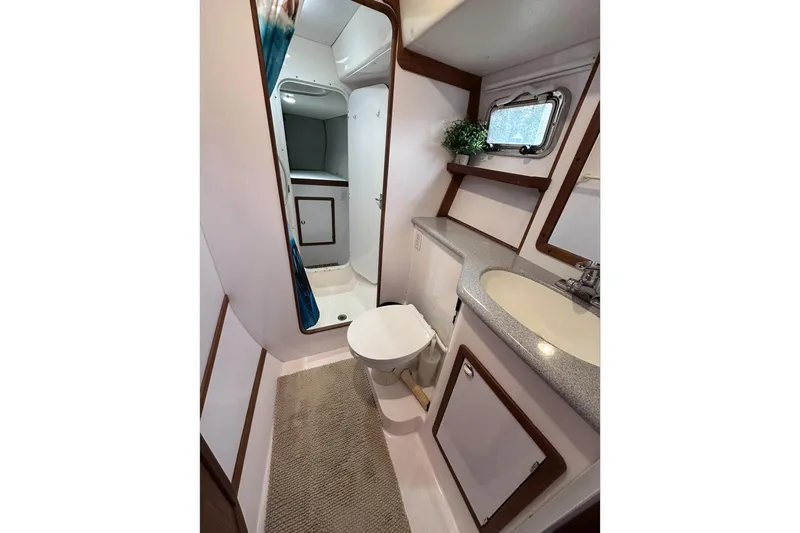 Slide: The Image of Bathroom interior of 2002 Endeavour Trawlercat 36 with shower, sink, and toilet. - 42