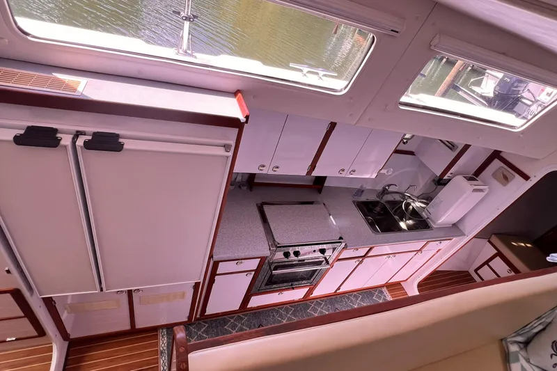 Slide: The Image of Interior view of 2002 Endeavour Trawlercat 36 kitchen with modern appliances and ample storage. - 46