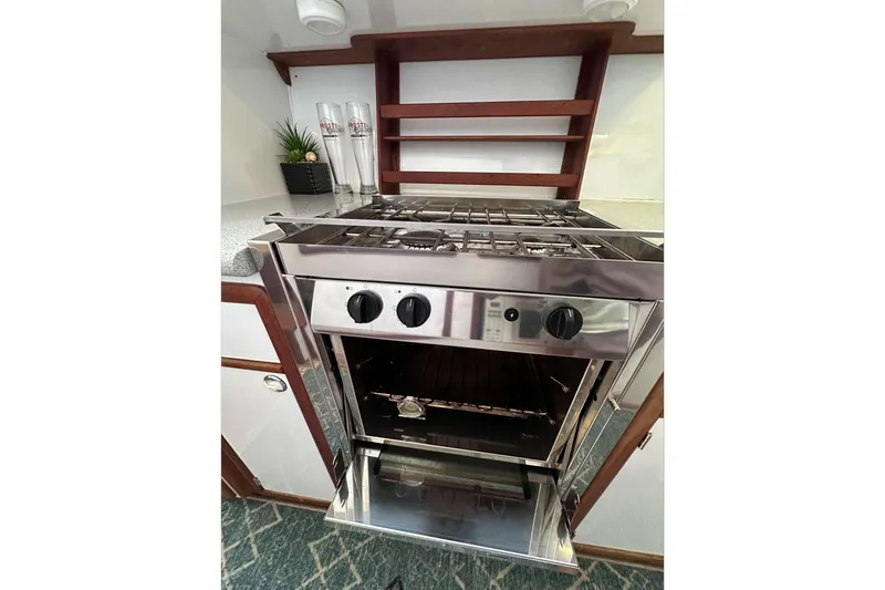 Slide: The Image of Stainless steel oven in 2002 Endeavour Trawlercat 36 kitchen with modern design. - 49