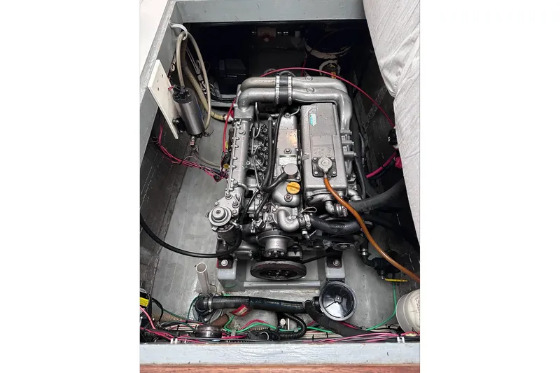 Slide: The Image of Engine compartment of a 2002 Endeavour Trawlercat 36, showcasing detailed mechanical components. - 58
