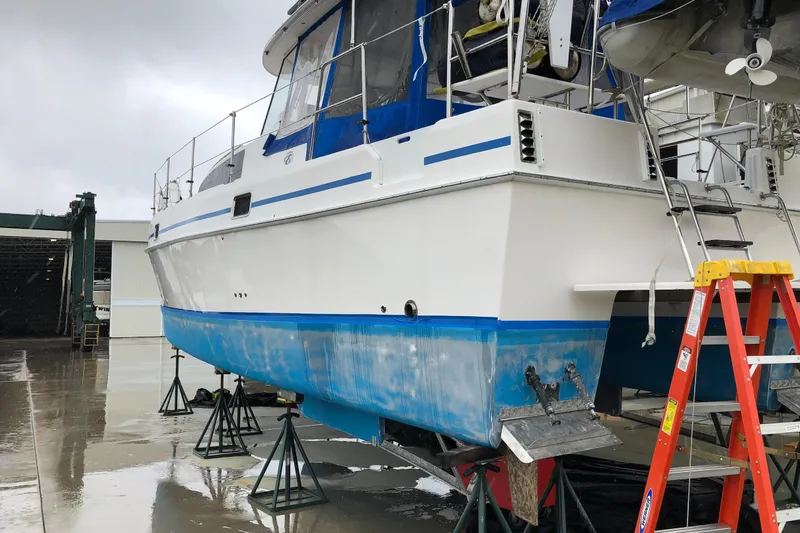 Slide: The Image of 2002 Endeavour Trawlercat 36 on stands, undergoing maintenance in a boatyard. - 60