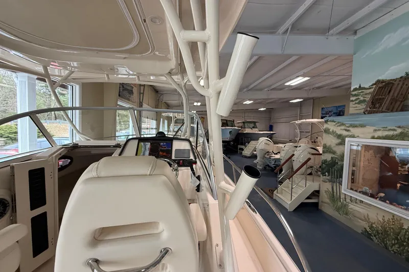 Slide: The Image of Interior view of 2026 Grady-White Adventure 218 boat in showroom setting. - 13