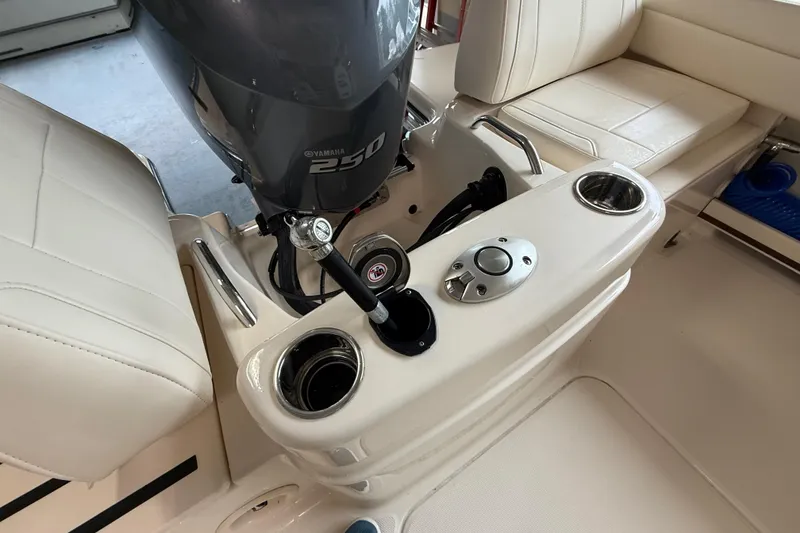 Slide: The Image of 2026 Grady-White Adventure 218 boat interior with Yamaha 250 engine and seating area. - 16