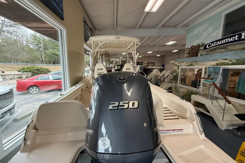 Slide: The Image of 2026 Grady-White Adventure 218 boat with Yamaha 250 engine in showroom. - 17