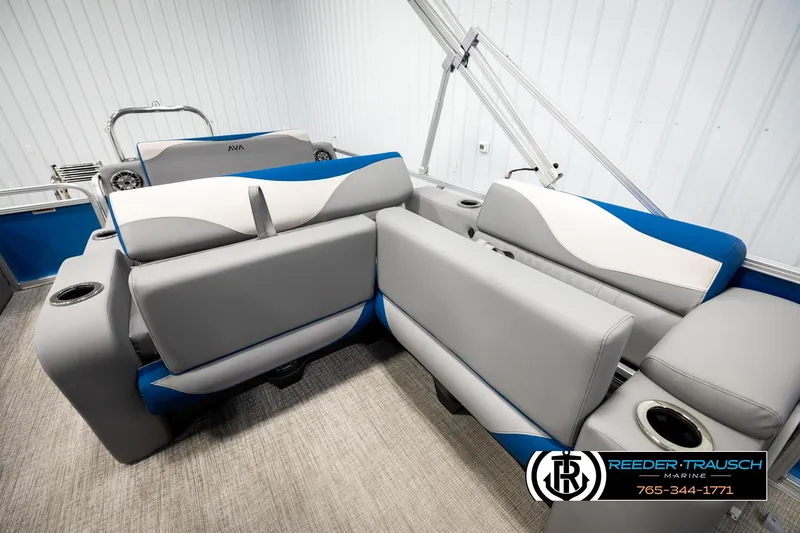 Slide: The Image of 2026 Avalon LSZ Vrl boat interior with gray and blue seating, cup holders, and modern design. - 22
