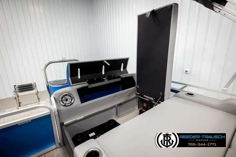 Slide: The Image of 2026 Avalon LSZ Vrl boat interior with storage compartment and speaker system. - 24