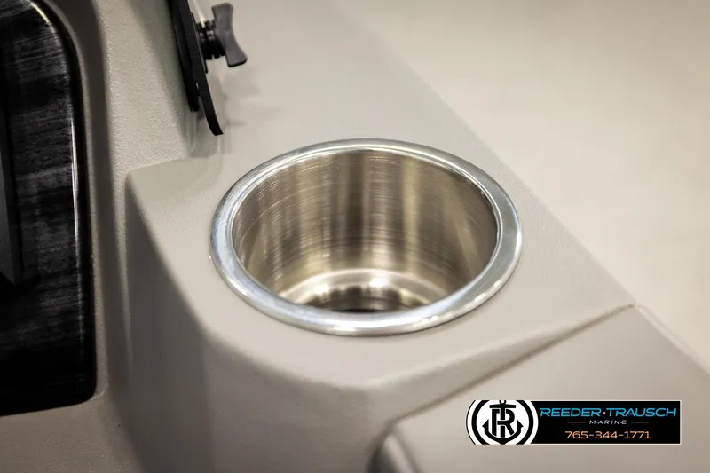 Slide: The Image of Cup holder in 2026 Avalon LSZ Vrl boat, Reeder-Trausch Marine logo visible. - 36