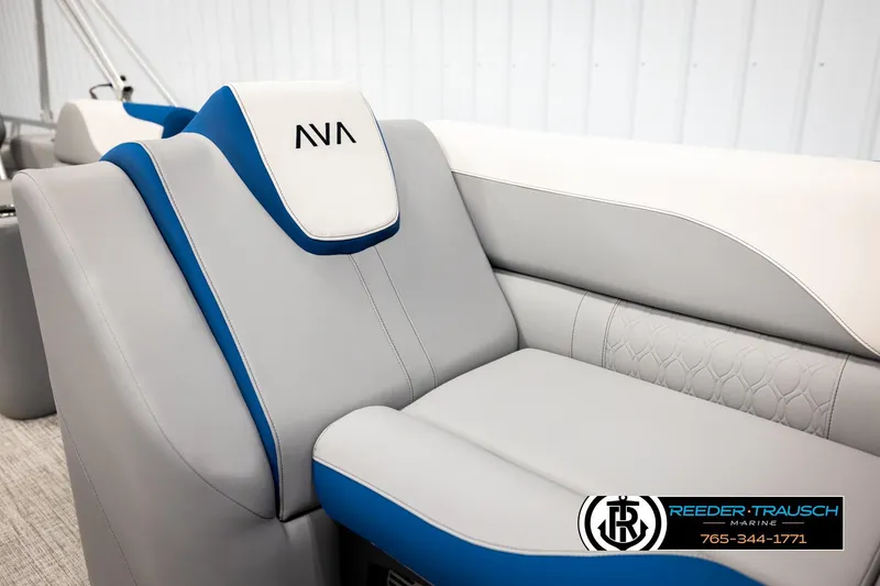 Slide: The Image of 2026 Avalon LSZ Vrl boat interior with gray and blue seating, Reeder-Trausch Marine logo. - 40