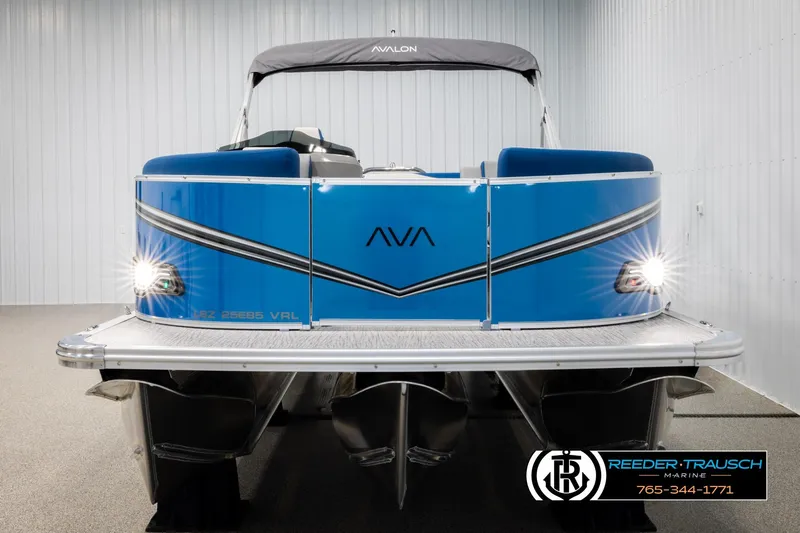 Slide: The Image of 2026 Avalon LSZ Vrl pontoon boat with blue exterior and sleek design in showroom. - 8