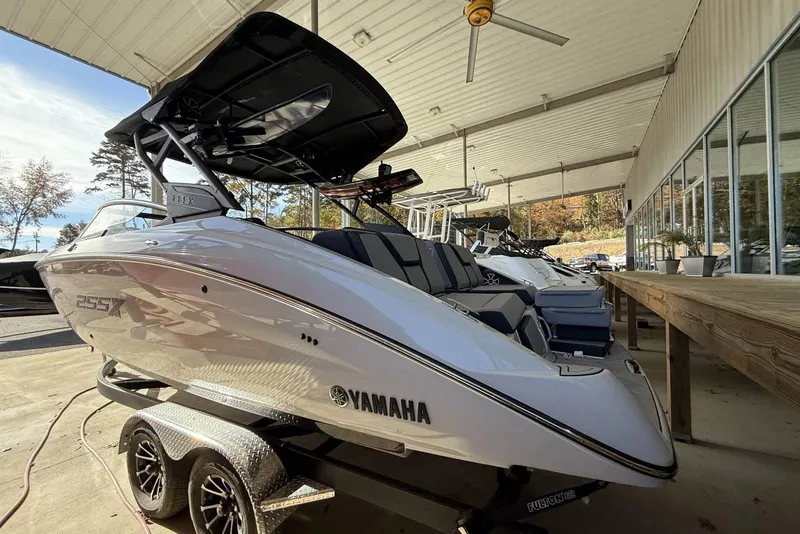 Slide: The Image of 2024 Yamaha Boats 255XD displayed in a showroom, showcasing sleek design and modern features. - 15