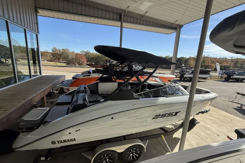 Slide: The Image of 2024 Yamaha Boats 255XD displayed in a showroom, featuring sleek design and modern features. - 3