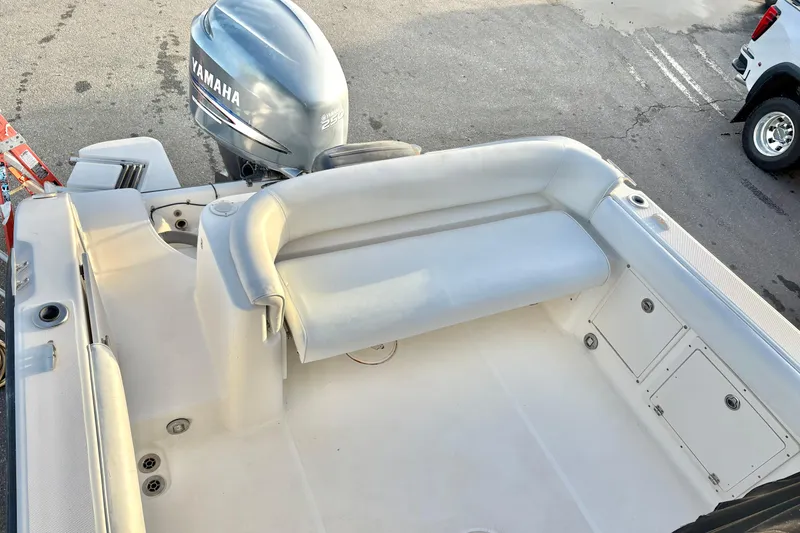 Slide: The Image of 2006 Century 2400 Walkaround boat with Yamaha engine, featuring spacious seating and storage compartments. - 11