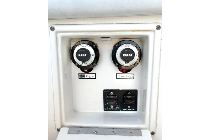Slide: The Image of Century 2400 Walkaround 2006 boat battery switches and controls panel. - 12