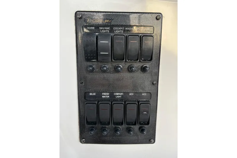 Slide: The Image of Century 2400 Walkaround 2006 boat control panel with labeled switches and buttons. - 18