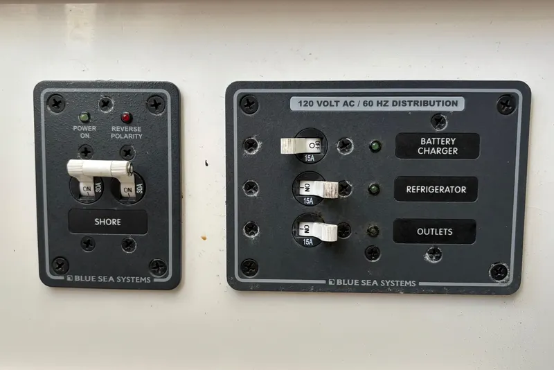 Slide: The Image of Electrical panel on a 2006 Century 2400 Walkaround boat by Blue Sea Systems. - 29